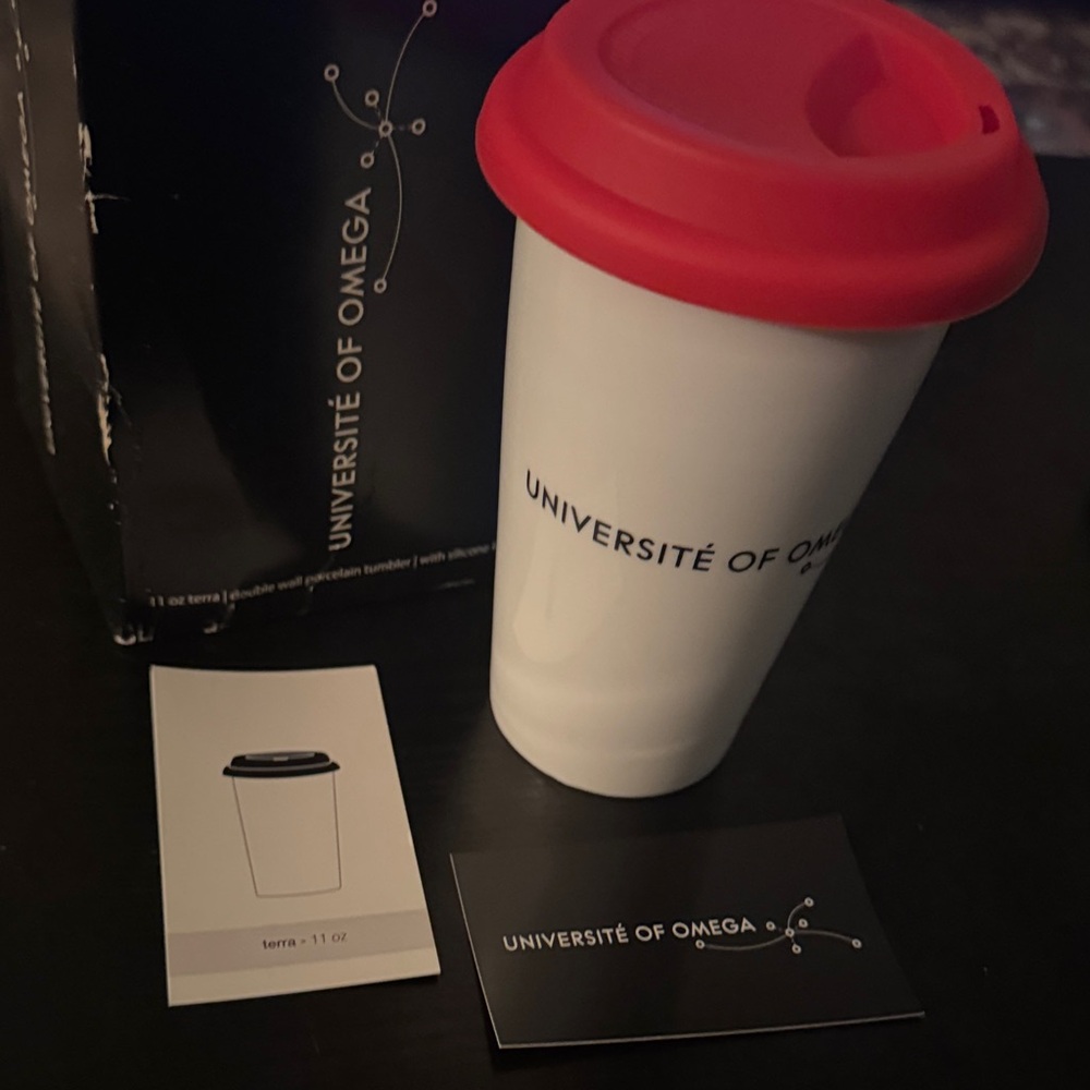 Université of Omega Travel Mug with Red Lid